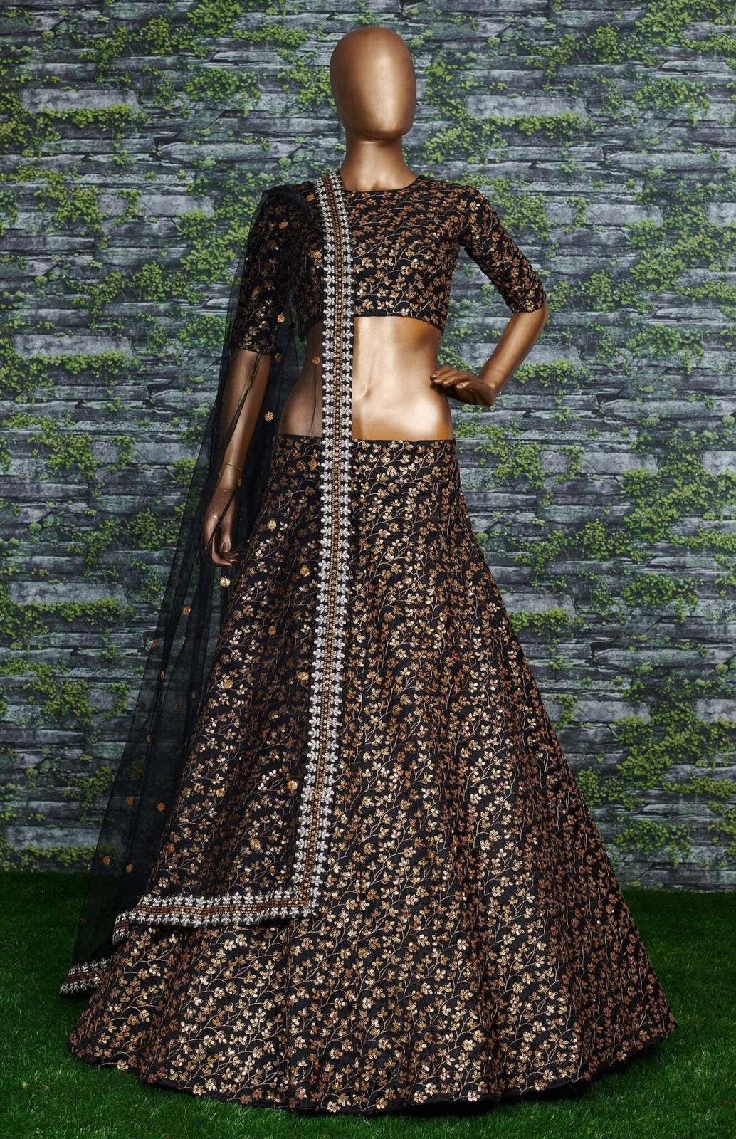 Featuring a black[color] Raw silk leheng pattern with golden sequins all over le