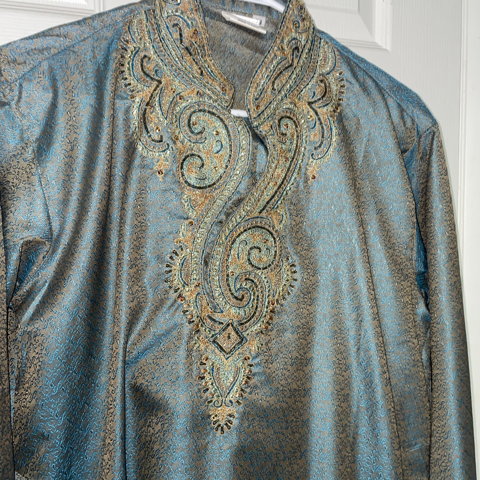 Turquoise And Gold Kurta With gold embroidery along the neckline