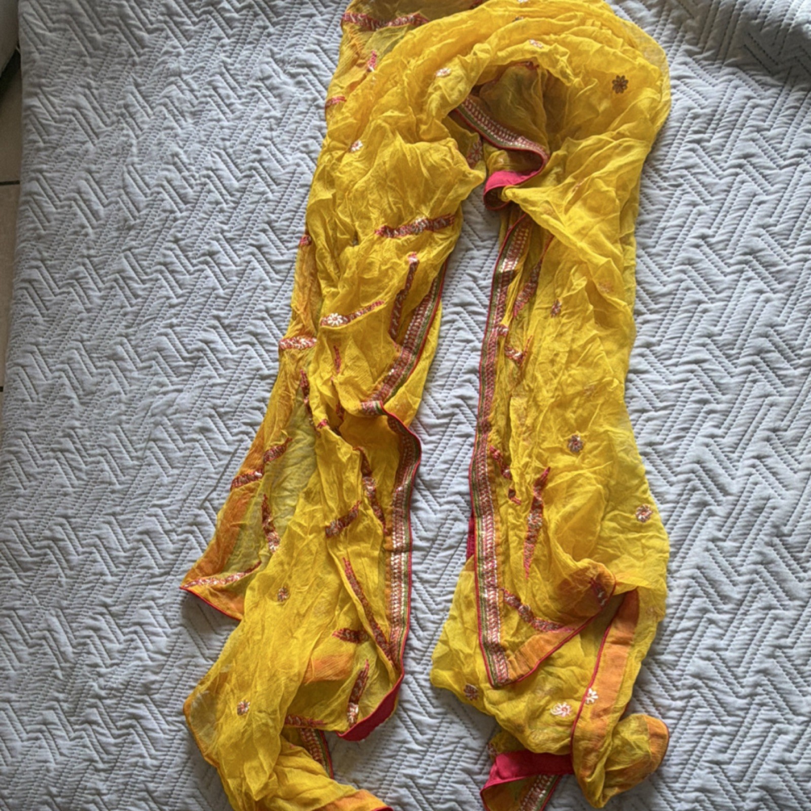 Yellow Chiffon Saree with Pink, Orange, and Gold Embroidered Border