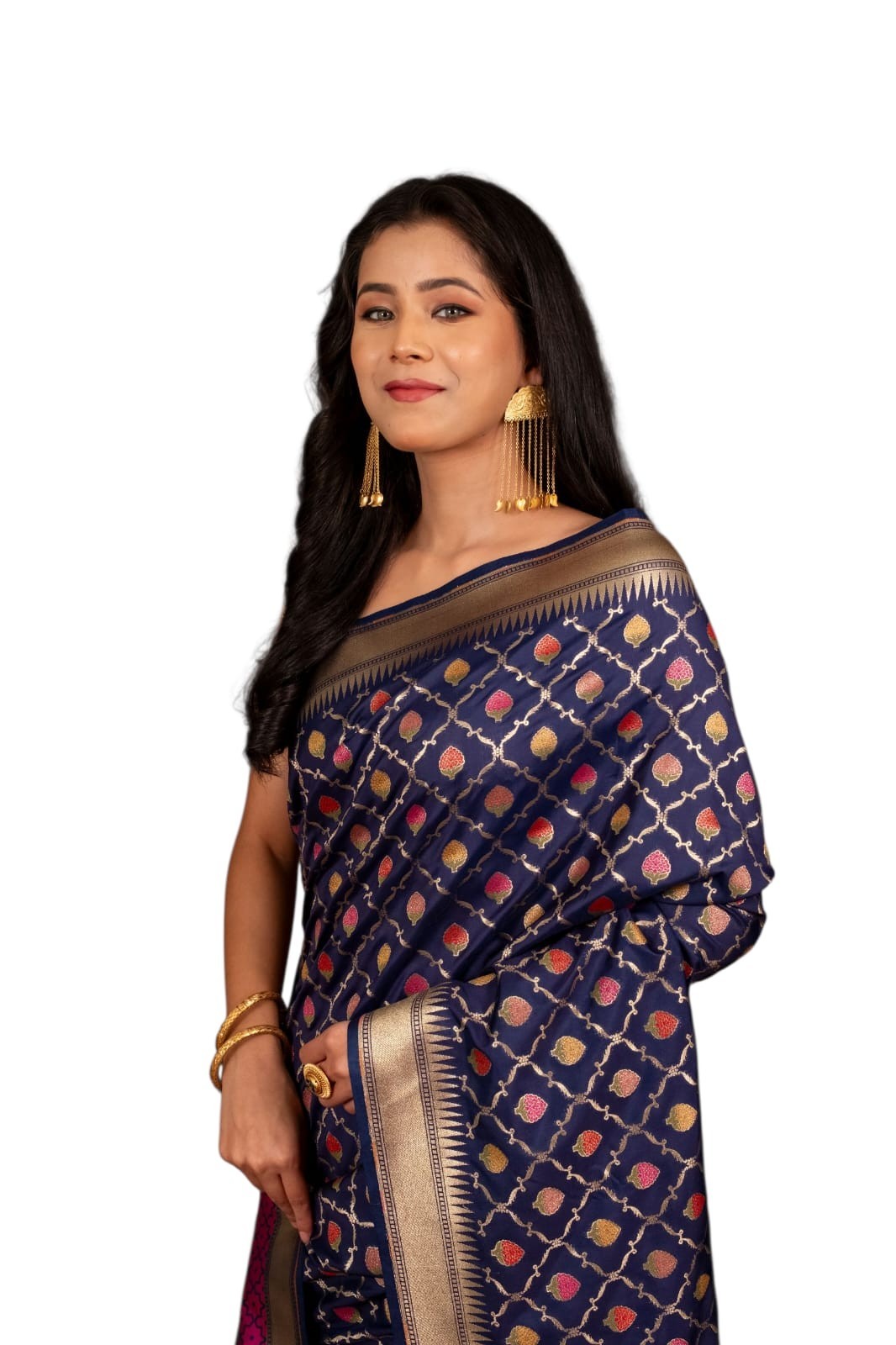 This royal purple saree, adorned with intricate golden motifs and a rich texture