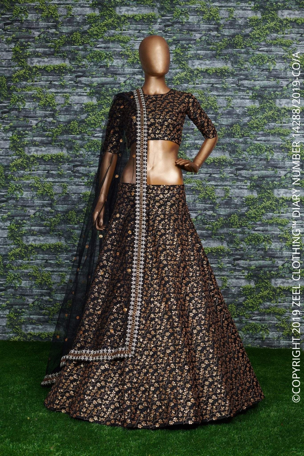 Featuring a black[color] Raw silk leheng pattern with golden sequins all over le