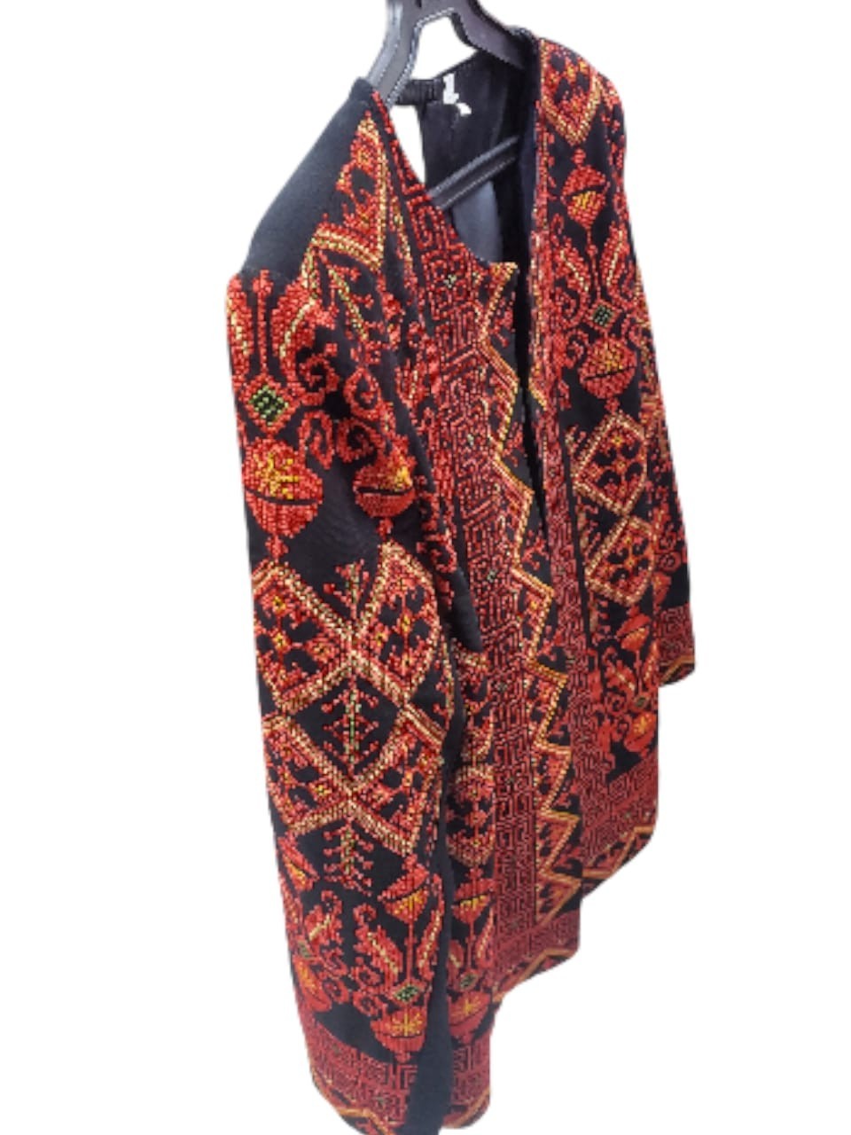 A hand-embroidered heritage jacket featuring traditional Arabic designs, in blac
