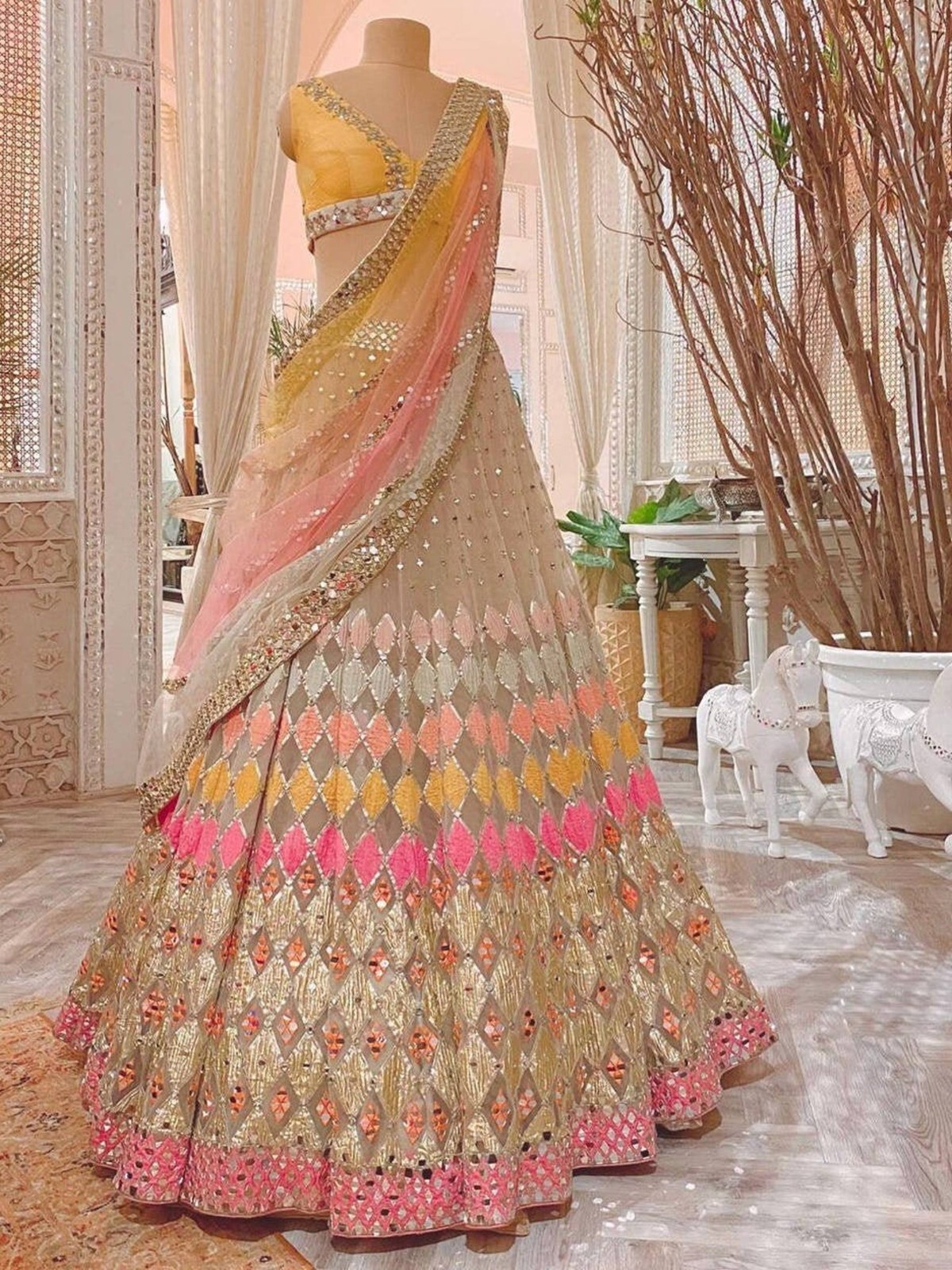 Beautiful Multi colored soft Net lehnga choli for woman with mirror & embroidery