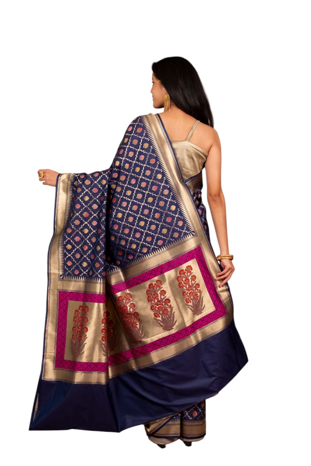 This royal purple saree, adorned with intricate golden motifs and a rich texture