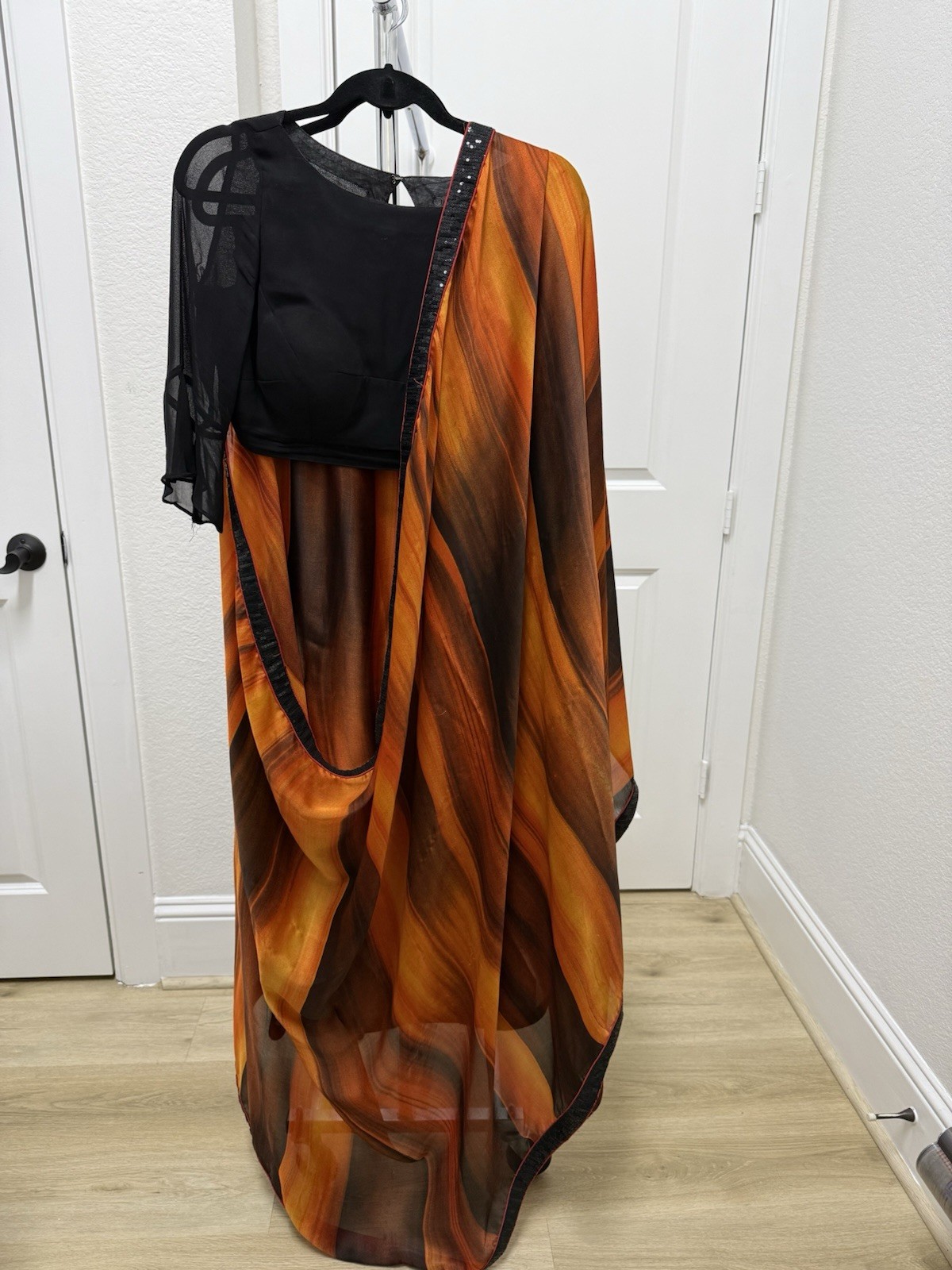 Orange And Black Silk Sari With Sequins Border And Black Blouse