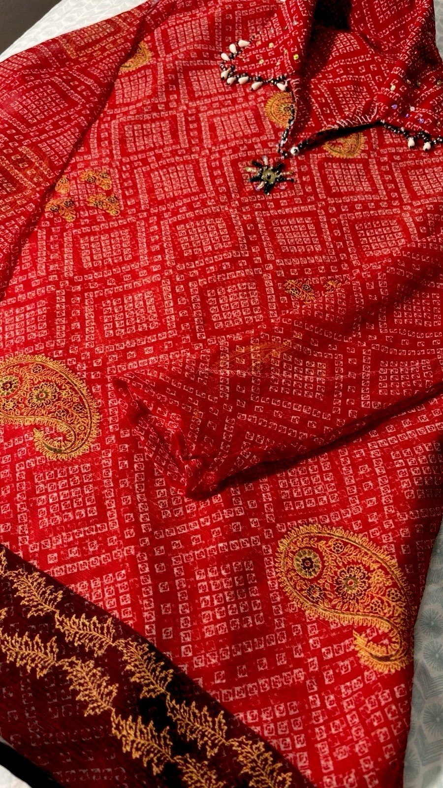Girls/Teens (32)Red Short Kurti. Stylish tassel and pendant work on the neckline