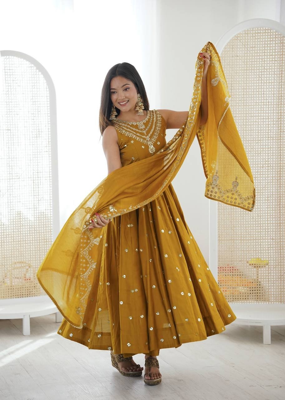 New Latest Roman Silk Yellow Gown Bottom With Dupatta For Indian Festival Wear