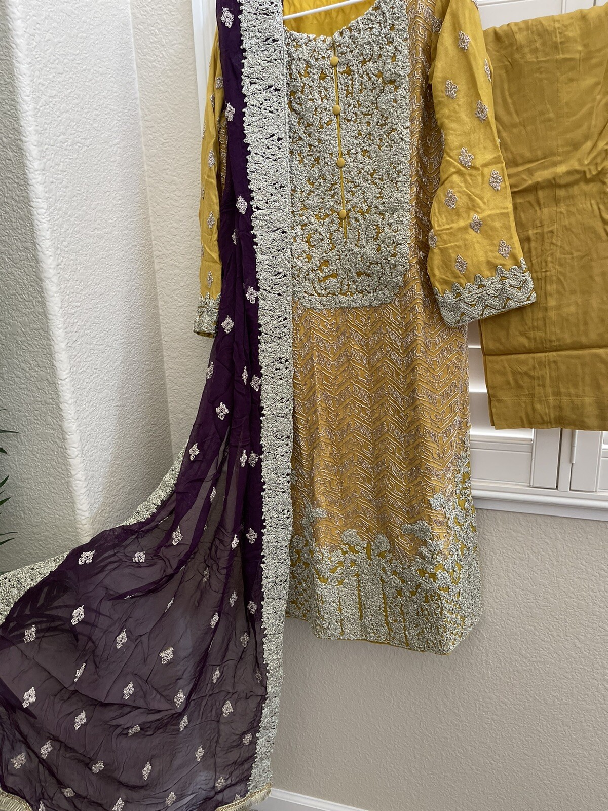 beautiful yellow and purple combination with dull silver ribbon work all over