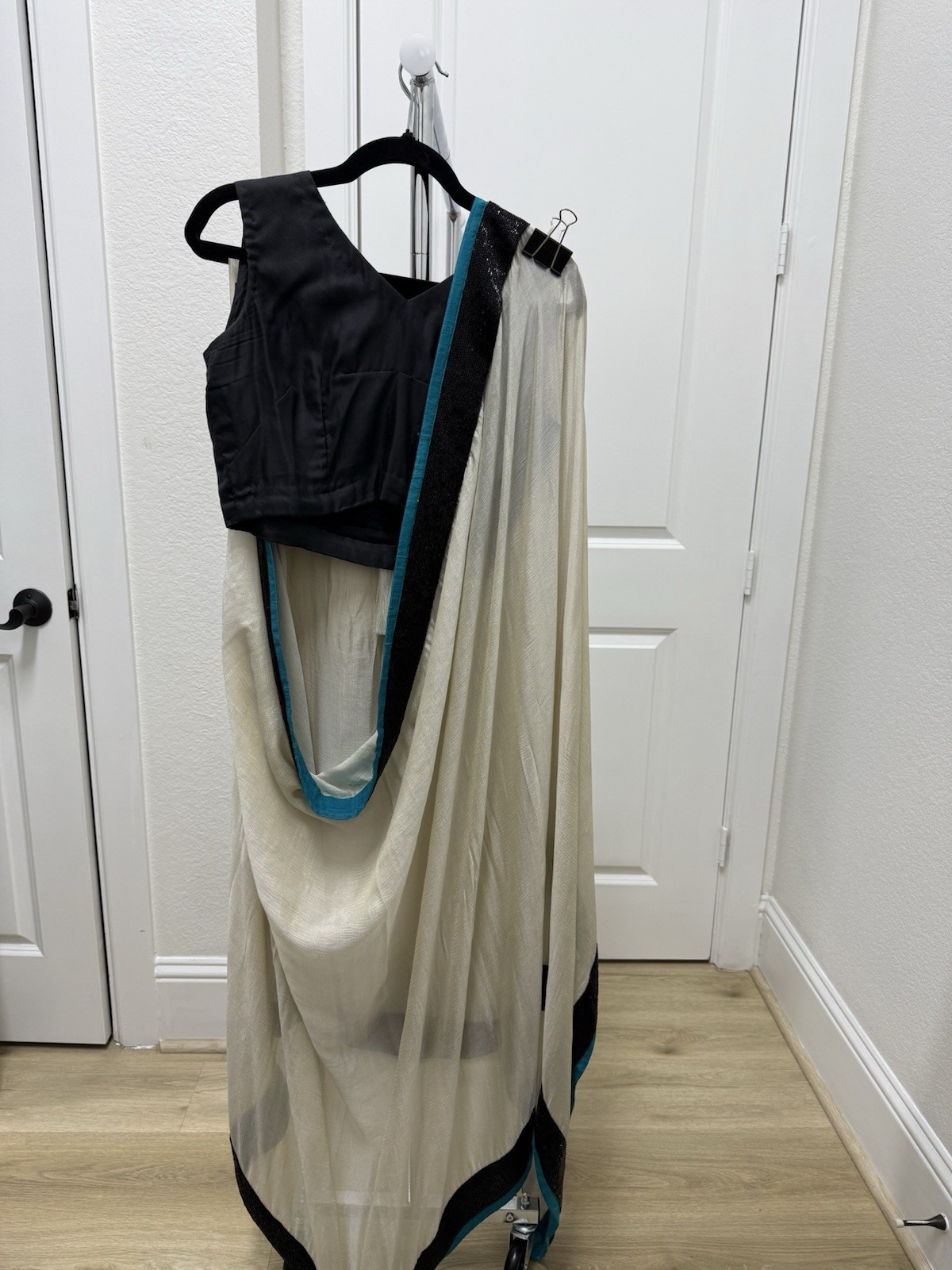 White crinkle chiffon blend sari with teal embroidered border and black blouse